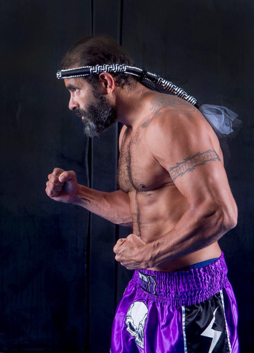 a man in a mauy thai fighting stance